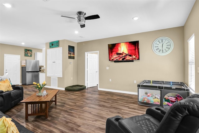 411 Johnson St, Longview, TX 75602 - living room with ceiling fan, baseboards, wood finished floors, and recessed lighting