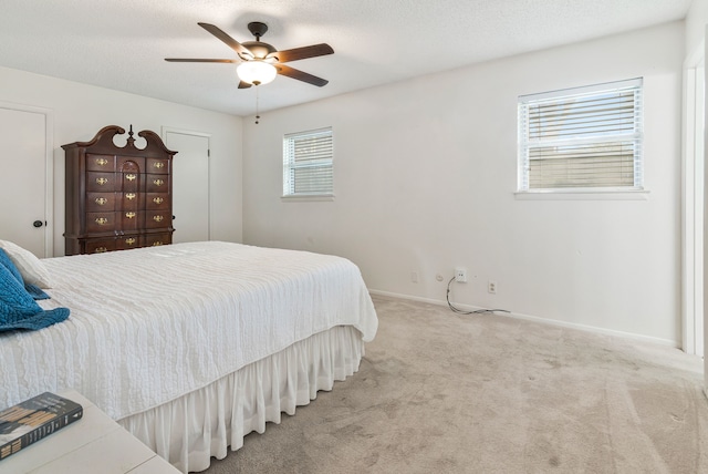 bedroom with baseboards, a ceiling fan, and carpet floors
