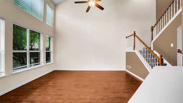908 Englewood Ln, Plano, TX 75025 - unfurnished living room featuring high vaulted ceiling, ceiling fan, wood finished floors, and stairs