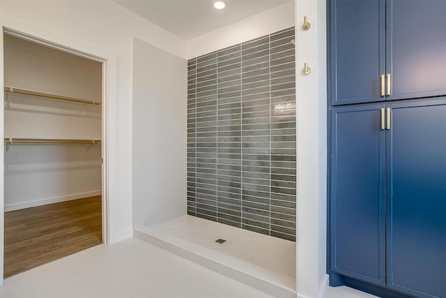 full bathroom with tile patterned flooring, a stall shower, and recessed lighting