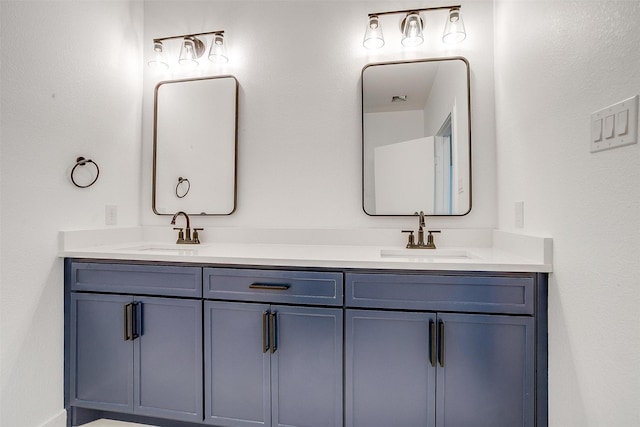 bathroom featuring double vanity and a sink
