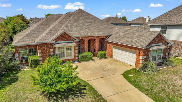 8708 Tangleridge Dr, Fort Worth, TX 76123 - view of front facade featuring brick siding and roof with shingles