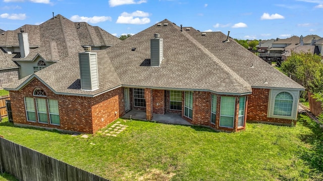 8708 Tangleridge Dr, Fort Worth, TX 76123 - rear view of property with a shingled roof, a patio area, brick siding, and a chimney