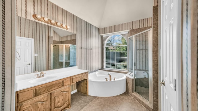8708 Tangleridge Dr, Fort Worth, TX 76123 - bathroom featuring wallpapered walls, a stall shower, a bath, vanity, and vaulted ceiling