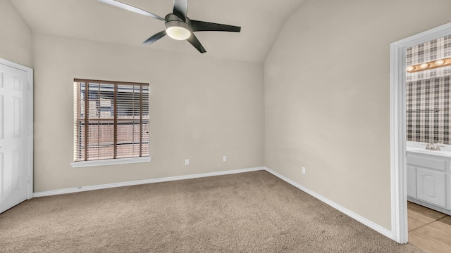 8708 Tangleridge Dr, Fort Worth, TX 76123 - unfurnished bedroom featuring light carpet, vaulted ceiling, a sink, connected bathroom, and baseboards