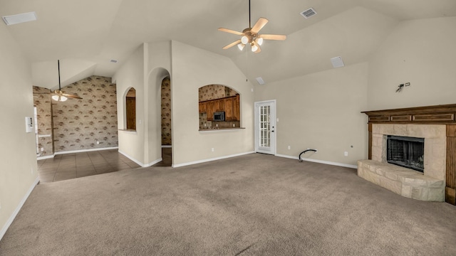 8708 Tangleridge Dr, Fort Worth, TX 76123 - unfurnished living room with a ceiling fan, carpet, vaulted ceiling, and a stone fireplace