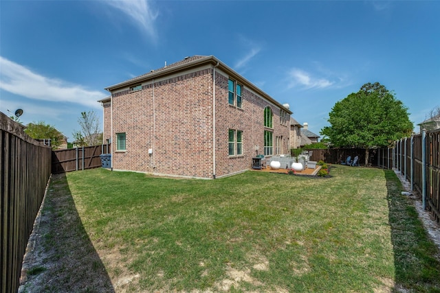 617 Denton Creek Dr, Mckinney, TX 75072 - rear view of house with a yard, a fenced backyard, and brick siding