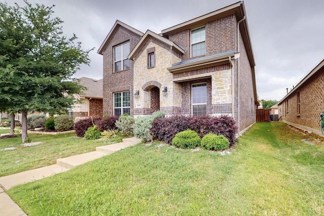 view of front of home featuring stone siding and brick siding