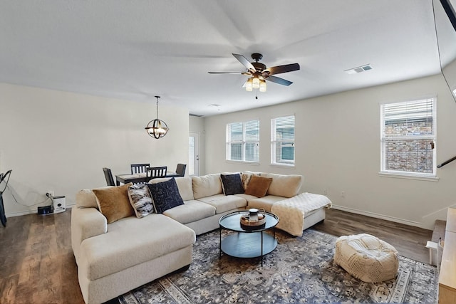 2425 Larimar Dr, Little Elm, TX 76227 - living area with plenty of natural light, wood finished floors, and baseboards