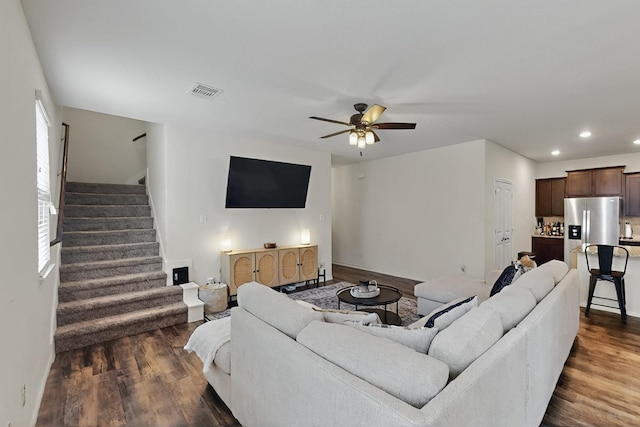 living area with dark wood-style floors, stairs, a ceiling fan, recessed lighting, and baseboards