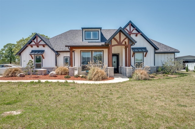 131 San Miguel Dr, Decatur, TX 76234 - view of front of home with a front yard, a shingled roof, and board and batten siding