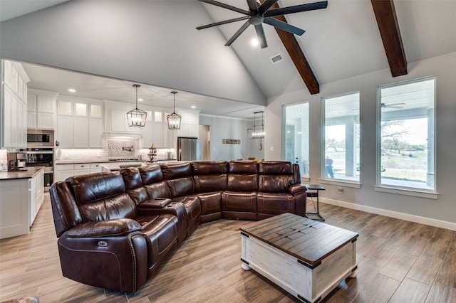 131 San Miguel Dr, Decatur, TX 76234 - living room with light wood finished floors, beam ceiling, recessed lighting, and ceiling fan with notable chandelier