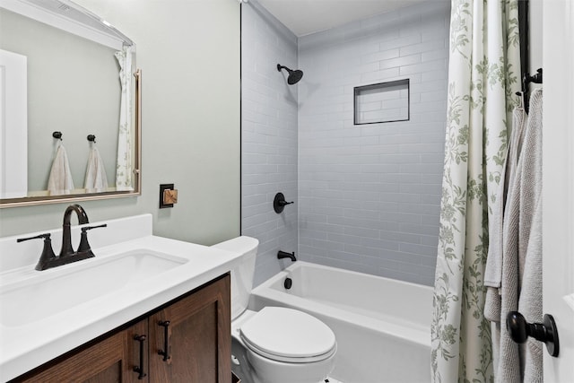 bathroom featuring toilet, vanity, and shower / bath combination with curtain