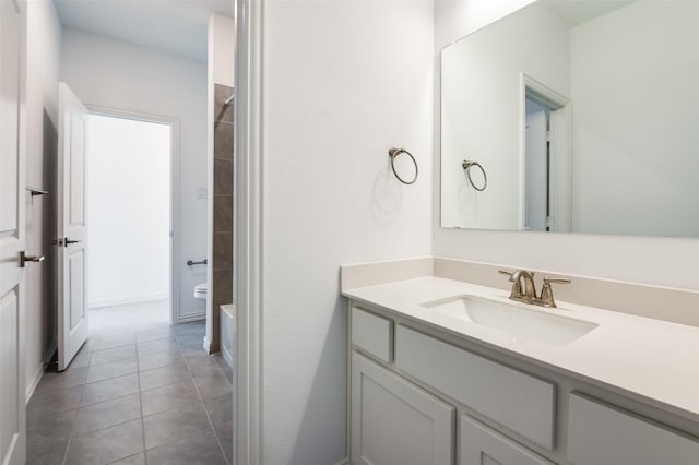 bathroom featuring vanity, tile patterned flooring, and shower / washtub combination
