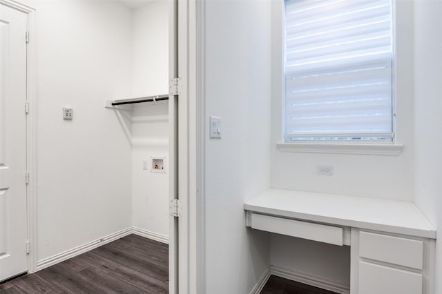 laundry area featuring dark wood-style floors, laundry area, baseboards, and washer hookup