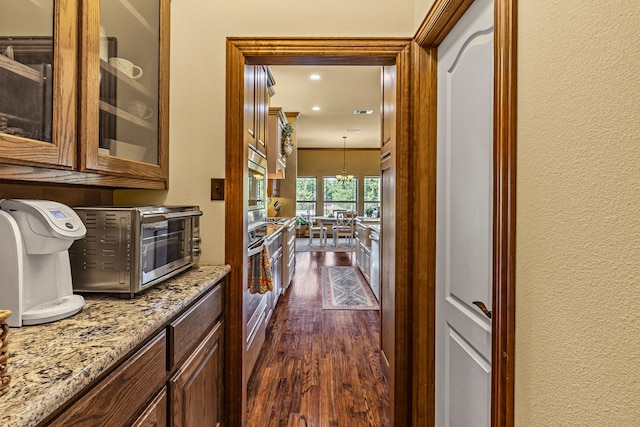 4682 County Road 2720, Caddo Mills, TX 75135 - corridor with dark wood-type flooring, a toaster, and a textured wall