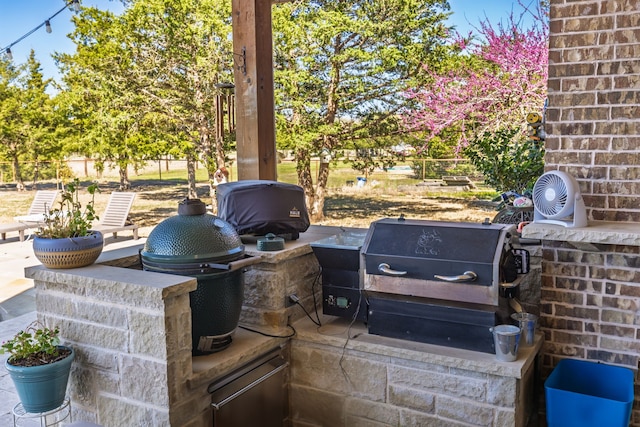 4682 County Road 2720, Caddo Mills, TX 75135 - view of patio / terrace with exterior kitchen, fence, and area for grilling