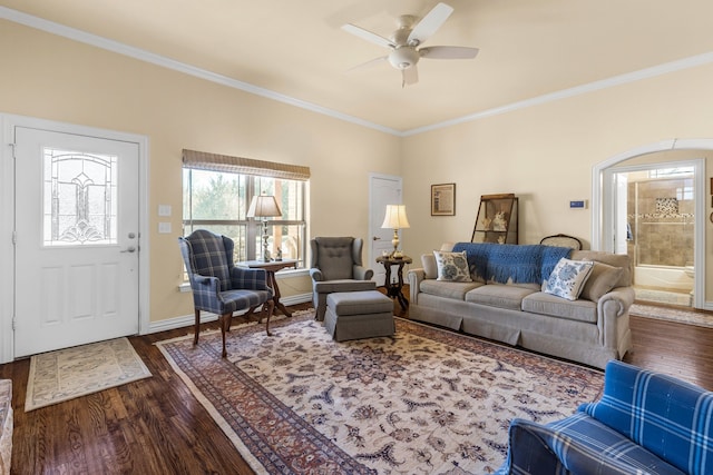 4682 County Road 2720, Caddo Mills, TX 75135 - living area with dark wood-style floors, baseboards, ornamental molding, and a ceiling fan