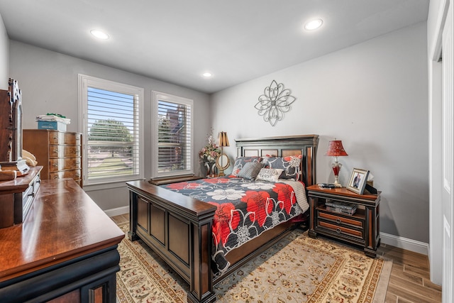 bedroom with baseboards, light wood-type flooring, and recessed lighting
