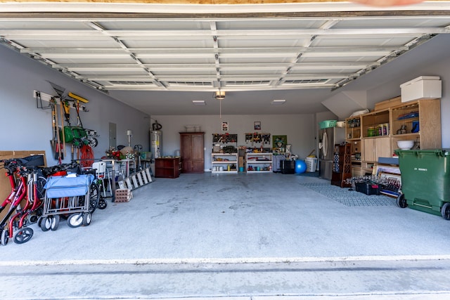 garage with water heater and electric panel