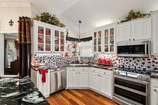 1412 Conejos Ct, Granbury, TX 76048 - kitchen featuring a sink, appliances with stainless steel finishes, tasteful backsplash, and vaulted ceiling