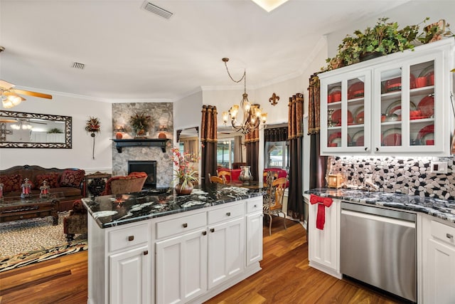 1412 Conejos Ct, Granbury, TX 76048 - kitchen featuring a fireplace, visible vents, ornamental molding, and dishwasher