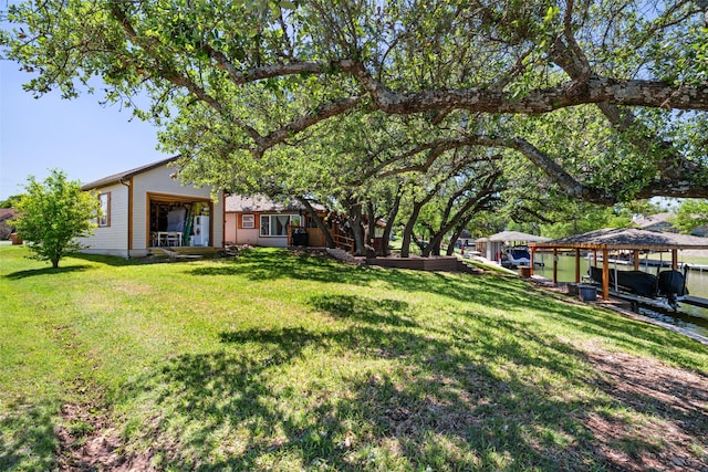 1412 Conejos Ct, Granbury, TX 76048 - view of yard featuring a boat dock and boat lift