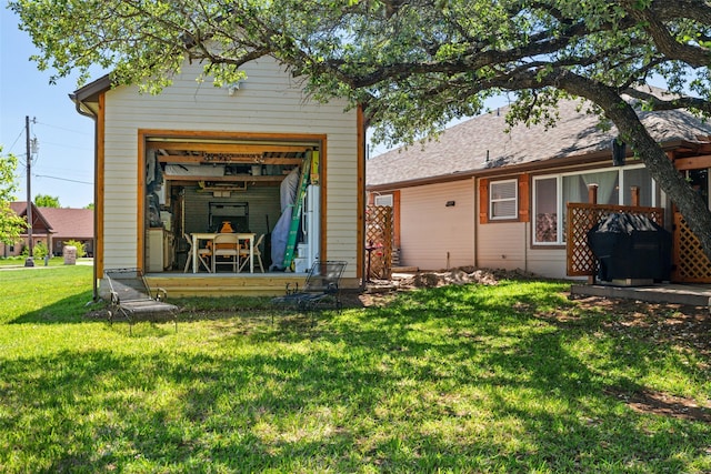 1412 Conejos Ct, Granbury, TX 76048 - rear view of property featuring a lawn