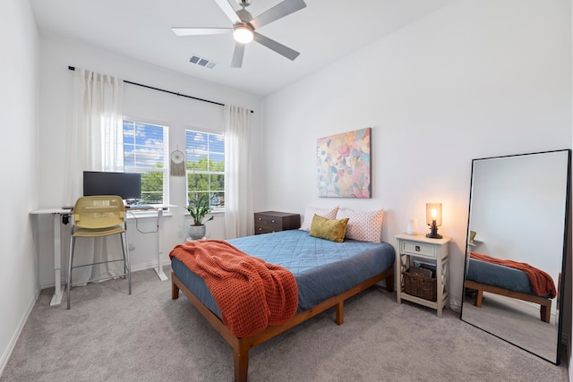 bedroom featuring baseboards, a ceiling fan, visible vents, and carpet floors
