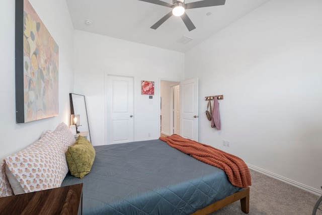 bedroom with baseboards, a ceiling fan, and carpet