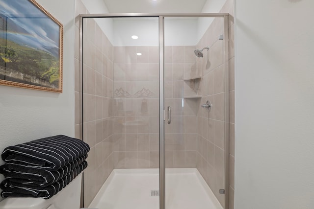 full bath featuring a shower stall