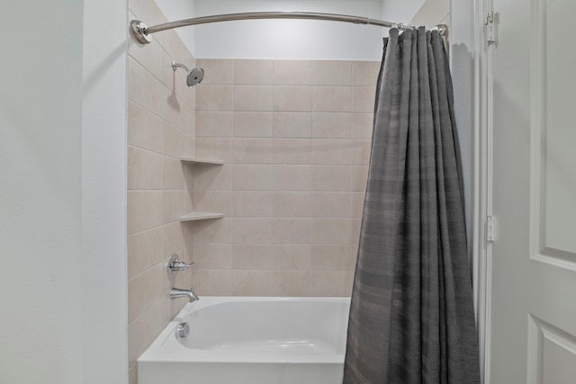 bathroom with shower / tub combo with curtain