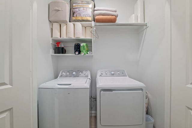washroom with separate washer and dryer