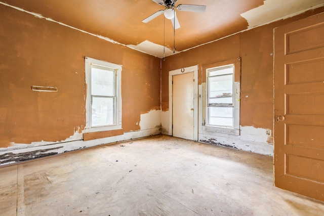 unfurnished room with a ceiling fan