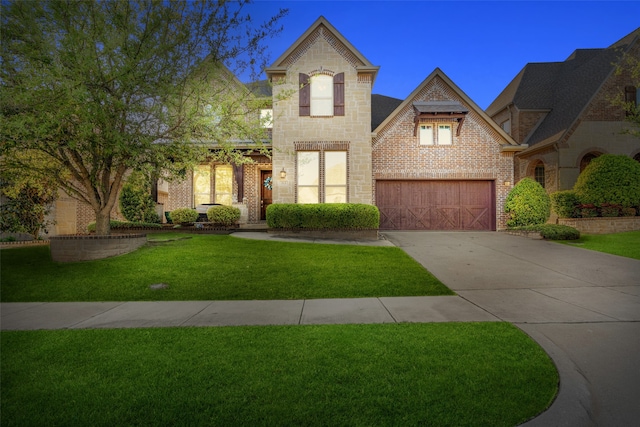 313 Grove Park Pl, Mckinney, TX 75071 - view of front facade with driveway, a front yard, brick siding, and stone siding
