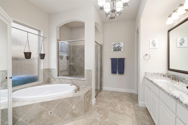 full bathroom featuring a bath, a stall shower, visible vents, a chandelier, and vanity