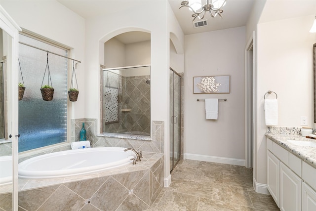313 Grove Park Pl, Mckinney, TX 75071 - full bath featuring vanity, a bath, a shower stall, and a chandelier