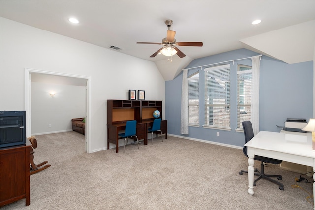 carpeted office space with baseboards, visible vents, recessed lighting, lofted ceiling, and ceiling fan
