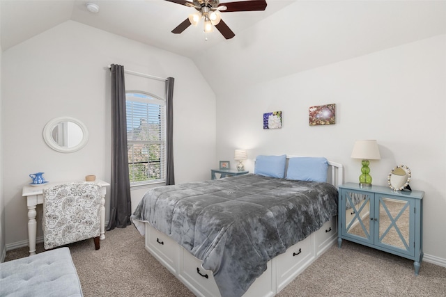 bedroom featuring ceiling fan, lofted ceiling, baseboards, and light carpet