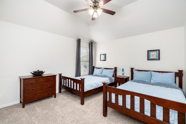bedroom featuring ceiling fan, light carpet, vaulted ceiling, and baseboards