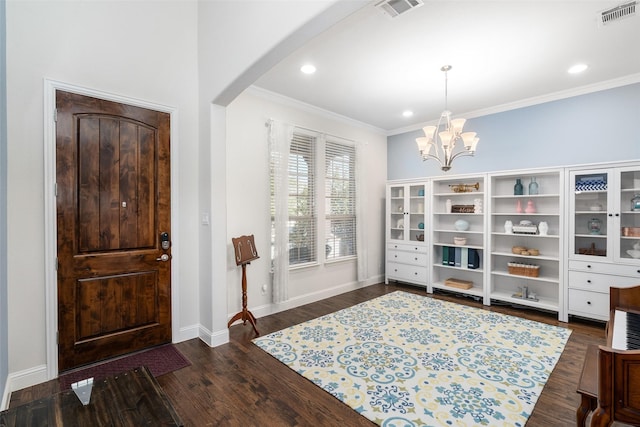 entryway with arched walkways, visible vents, ornamental molding, and a notable chandelier