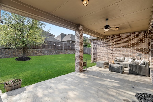 view of patio with a fenced backyard, an outdoor living space, and ceiling fan