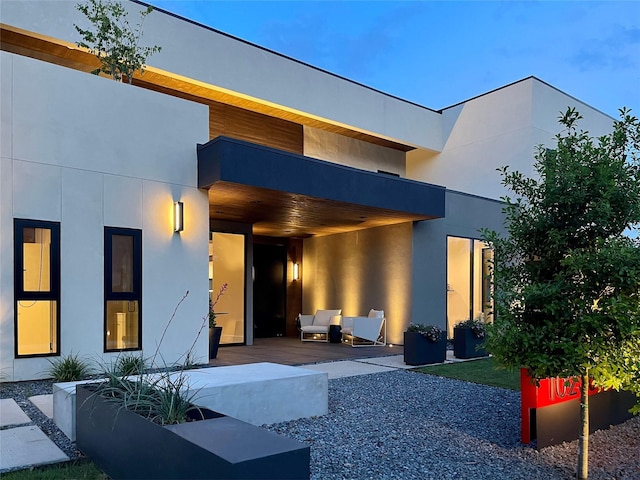 10236 Crestover Dr, Dallas, TX 75229 - back of property featuring stucco siding, a balcony, outdoor lounge area, and a patio