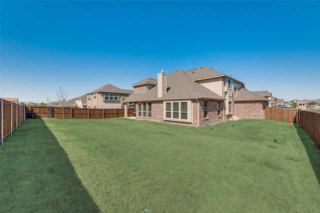 6517 Harwich Dr, Mesquite, TX 75181 - back of property with a shingled roof, a lawn, a chimney, a fenced backyard, and brick siding
