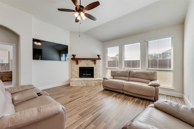 6517 Harwich Dr, Mesquite, TX 75181 - living room featuring baseboards, ceiling fan, a fireplace, wood finished floors, and lofted ceiling