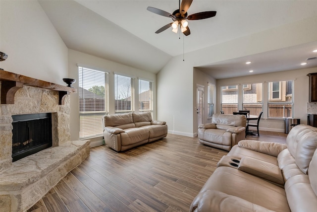 6517 Harwich Dr, Mesquite, TX 75181 - living area with baseboards, a ceiling fan, wood finished floors, and a fireplace
