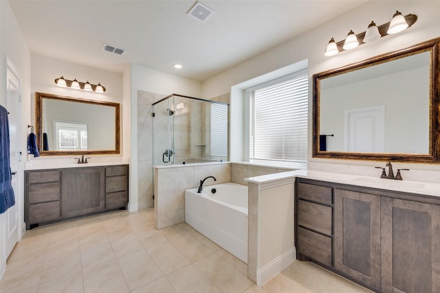 6517 Harwich Dr, Mesquite, TX 75181 - full bathroom featuring a sink, visible vents, a stall shower, and tile patterned flooring