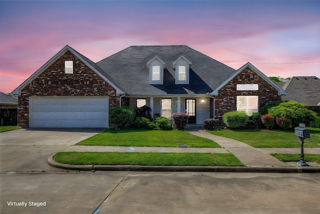 800 Austin Acre, Sulphur Springs, TX 75482 - view of front of home featuring driveway, a yard, an attached garage, brick siding, and covered porch