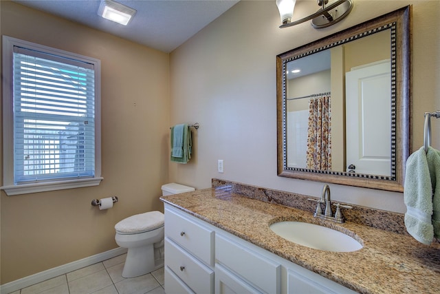 full bathroom featuring a shower with shower curtain, vanity, baseboards, tile patterned floors, and toilet