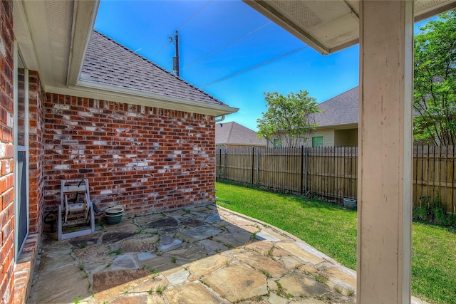 view of patio featuring fence